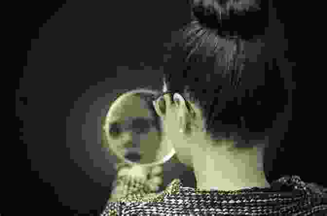 An Image Of A Person Looking Into A Mirror, Symbolizing The Exploration Of The Unconscious Mind And Its Connection To Wit. Wit And Its Relation To The Unconscious