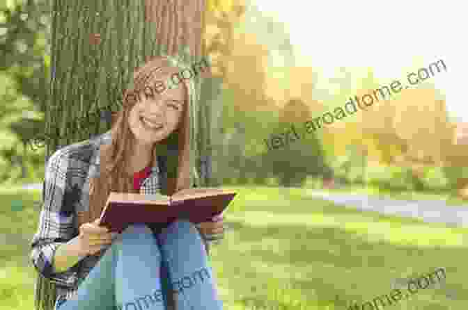 An Image Of A Person Smiling While Reading, Highlighting The Positive Psychological Effects Of Wit. Wit And Its Relation To The Unconscious